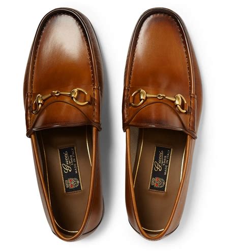 gold guccis hoes|Gucci loafers for men.